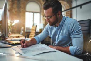 busy bearded man in eyeglasses