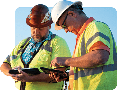 Two men using HCSS software