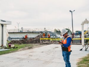 construction site supervisor with tablet water treatment plant.